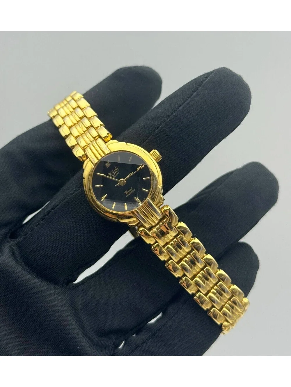 Kish Black Face Gold Case Gold Tone Bracelet Strap New Battery CZ stone 0.05CT